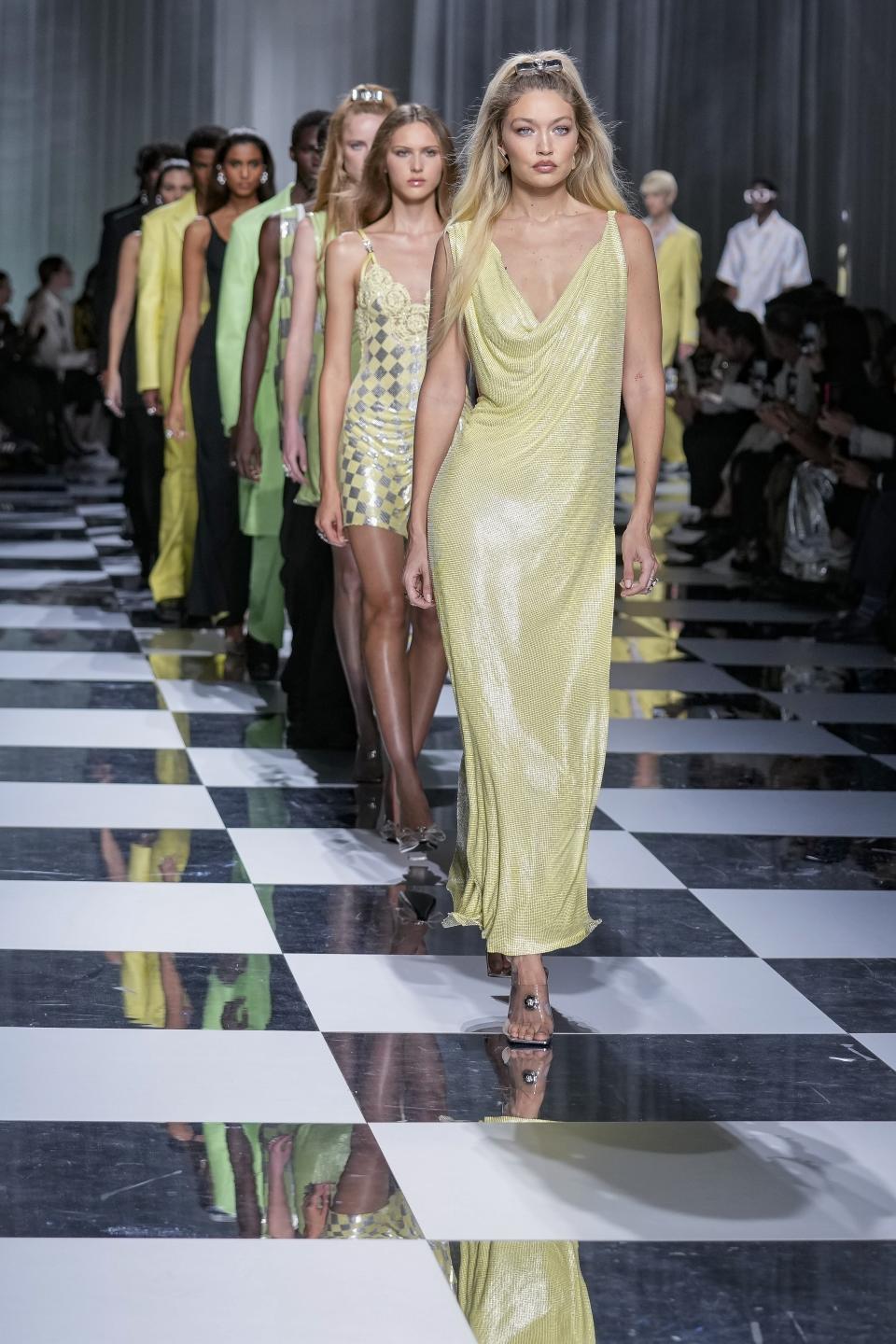 Gigi Hadid leads other models as they wear creations as part of the Versace women's Spring Summer 2024 collection presented in Milan, Italy, Friday, Sept. 22, 2023. (AP Photo/Antonio Calanni)