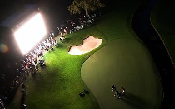 Wentworth's 18th green in near darkness on Friday - Rory McIlroy brands late finish at Wentworth a 's---show' after play grinds to halt