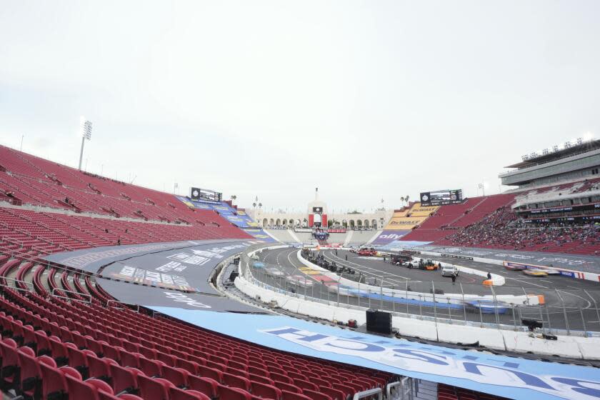Drivers race during qualifying heats for the Busch Light Clash NASCAR exhibition auto race at Los Angeles Memorial Coliseum Saturday, Feb. 3, 2024, in Los Angeles. (AP Photo/Mark J. Terrill)