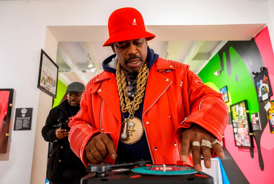 In this file photo taken on January 19, 2019 Grandmaster Caz looks at Hip-Hop memorabilia at the Hip-Hop Museum Pop Up Experience in Washington, DC.