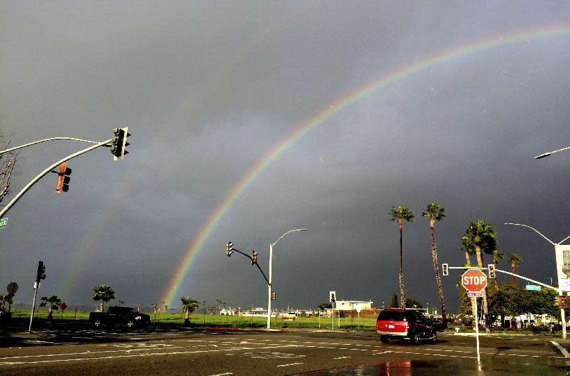 A rainbow appears over Seal Beach, Calif. on Monday, Jan. 23, 2017. The tail end of a punishing winter storm system lashed California with thunderstorms and severe winds Monday after breaking rainfall records, washing out roads and whipping up enormous waves. (AP Photo/Amy Taxin)
