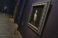 Titian's Portrait of Ranuccio Farnese, painted in 1541-1542, on loan from the National Gallery of Art in Washington, is seen during a press preview of the Remember Me exhibit at the Rijksmuseum in Amsterdam, Netherlands, Tuesday, Sept. 28, 2021. As COVID-19 lockdowns ease and borders reopen, there is a gathering at Amsterdam's Rijksmuseum of people from around Europe, depicted in more than 100 Renaissance portraits. The Dutch national museum's new exhibition “Remember Me,” covers the century 1470-1570. (AP Photo/Peter Dejong)