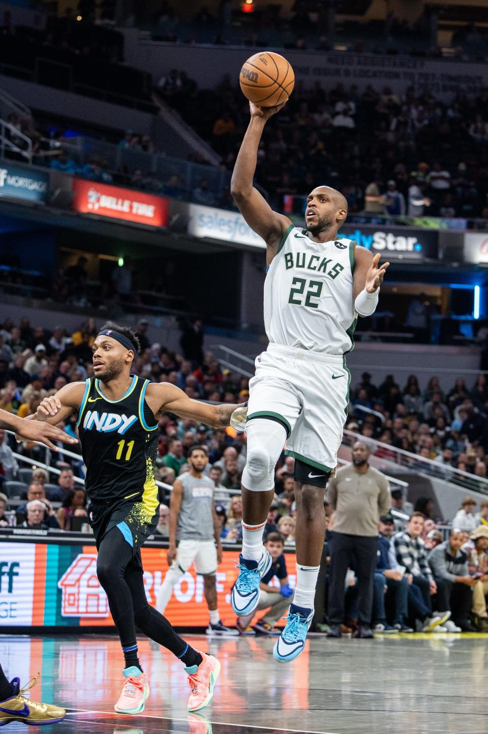 Bucks forward Khris Middleton shoots the ball while Indiana Pacers forward Bruce Brown defends at Gainbridge Fieldhouse on Nov. 9.