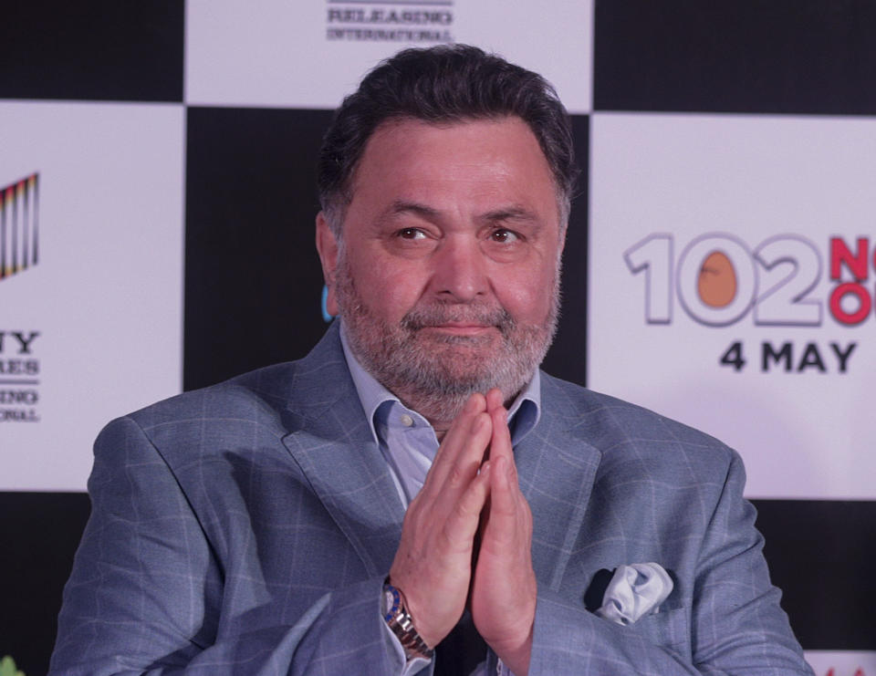 FILE- In this April 19, 2018 file photo, Bollywood actor Rishi Kapoor greets media as he arrives for the song launch of film '102 Not Out' in Mumbai, India. Rishi Kapoor, a top Indian actor and a scion of Bollywood’s most famous Kapoor family, has died after a battle with cancer. He was 67.(AP Photo/Rafiq Maqbool, File)