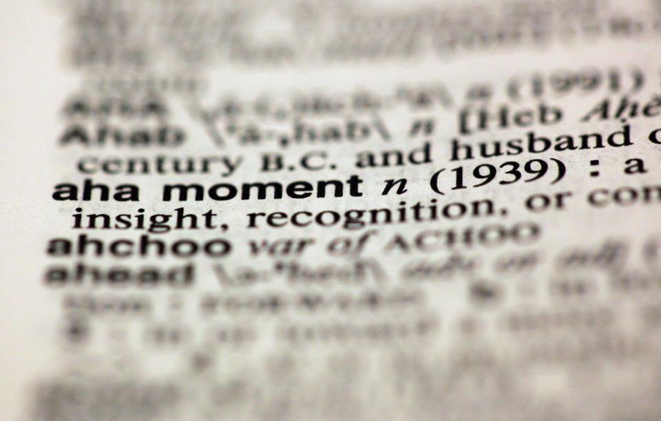 The entry "aha moment," photographed in New York, Friday, Aug. 10, 2012, is one of the 15 new additions in the 11th edition of Merriam-Webster's Collegiate Dictionary. (AP Photo/Richard Drew)