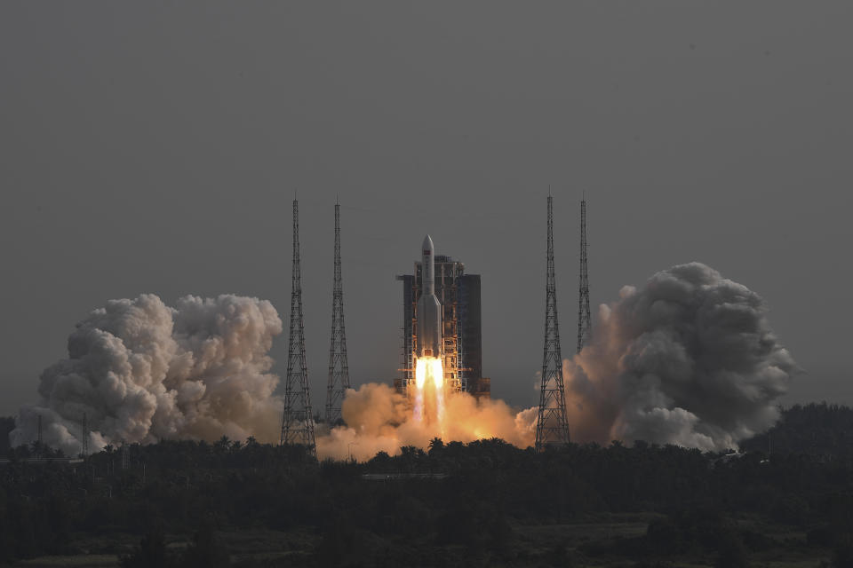 In this photo released by Xinhua News Agency, the Long March-5B Y4 carrier rocket carrying the space lab module Mengtian, blasts off from the Wenchang Satellite Launch Center in south China's Hainan Province, Monday, Oct. 31, 2022. China has launched the third and final module to complete its permanent space station, realizing a more than decade-long endeavor to maintain a constant crewed presence in orbit. (Hu Zhixuan/Xinhua via AP)