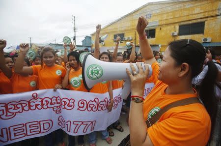 Garment workers shout during a protest calling for higher wages in Phnom Penh September 17, 2014. REUTERS/Samrang Pring