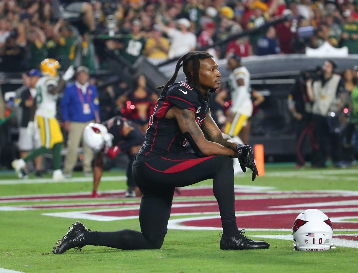 Arizona Cardinals wide receiver DeAndre Hopkins (10) kneels in the end zone after a game clinching interception in the final seconds by Green Bay Packers cornerback Rasul Douglas in the fourth quarter in Glendale, Ariz. Oct. 28, 2021.