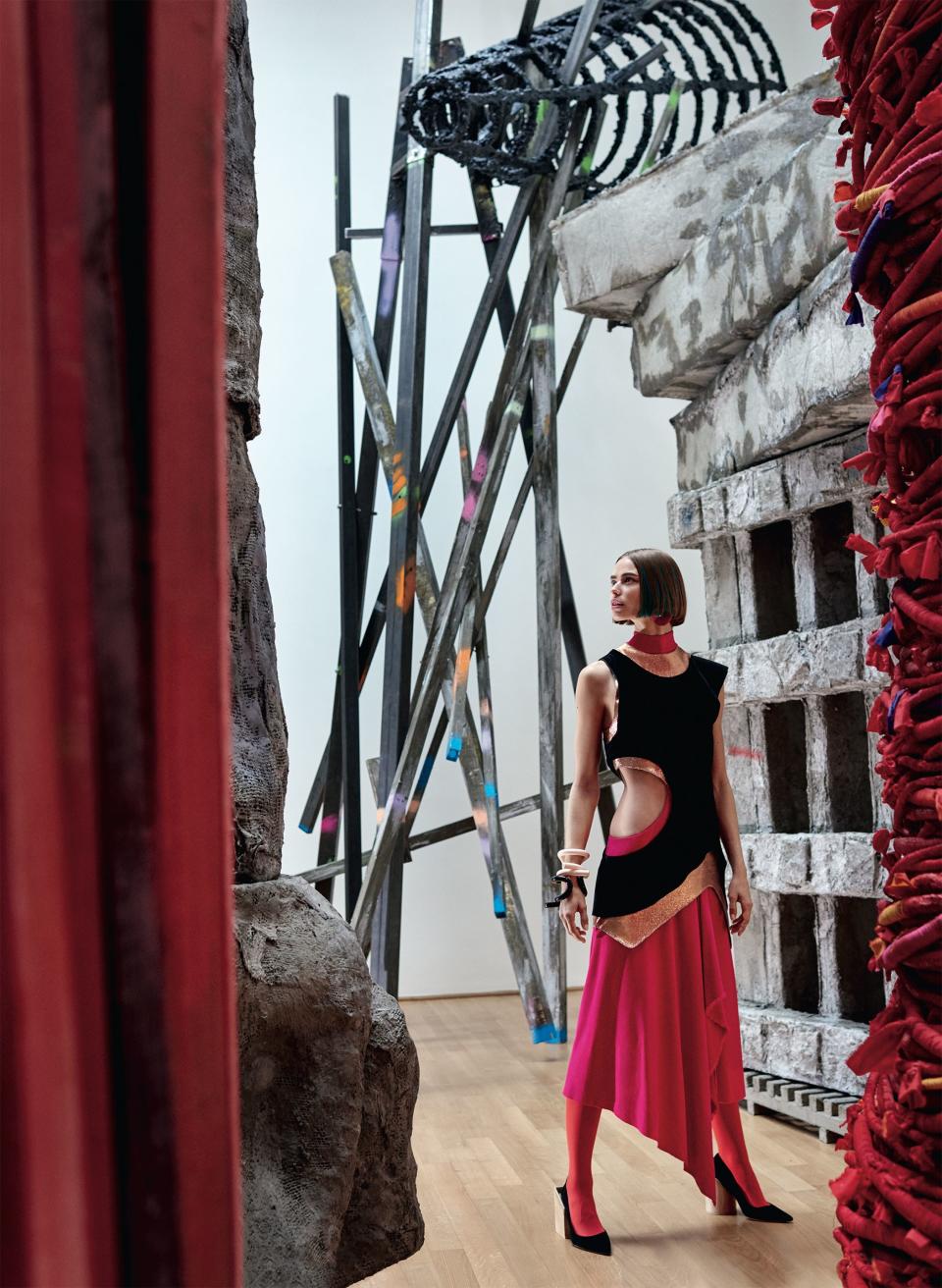 <strong>All the Right Angles</strong> With so many points of interest—a bias cut here, a revealing cutout there—it’s hard to focus on just one, especially when they’re set against Phyllida Barlow’s British Council commission at the British Pavilion. Proenza Schouler dress ($4,850) and cuffs; Proenza Schouler, NYC. Emporio Armani earring. Jacquemus shoes.