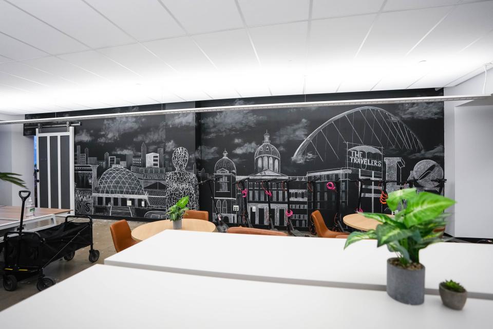 A chalk mural of Des Moines tourist attractions decorates a wall in the OpenLoop offices.