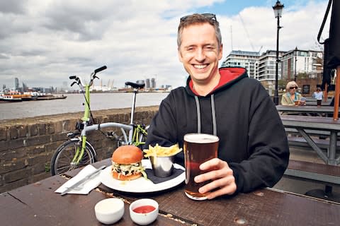 Jonny Cooper with his bicycle at the Cutty Sark pub - Credit: RII SCHROER
