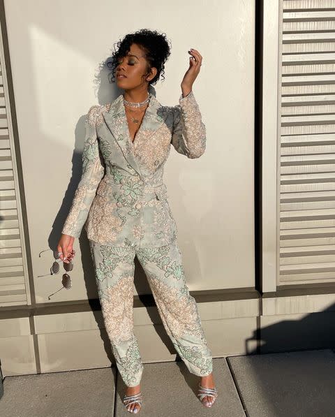 <p>frosts herself in "million dollar diamonds" courtesy Chopard and a pastel, floral embroidered Miu Miu suit. </p>