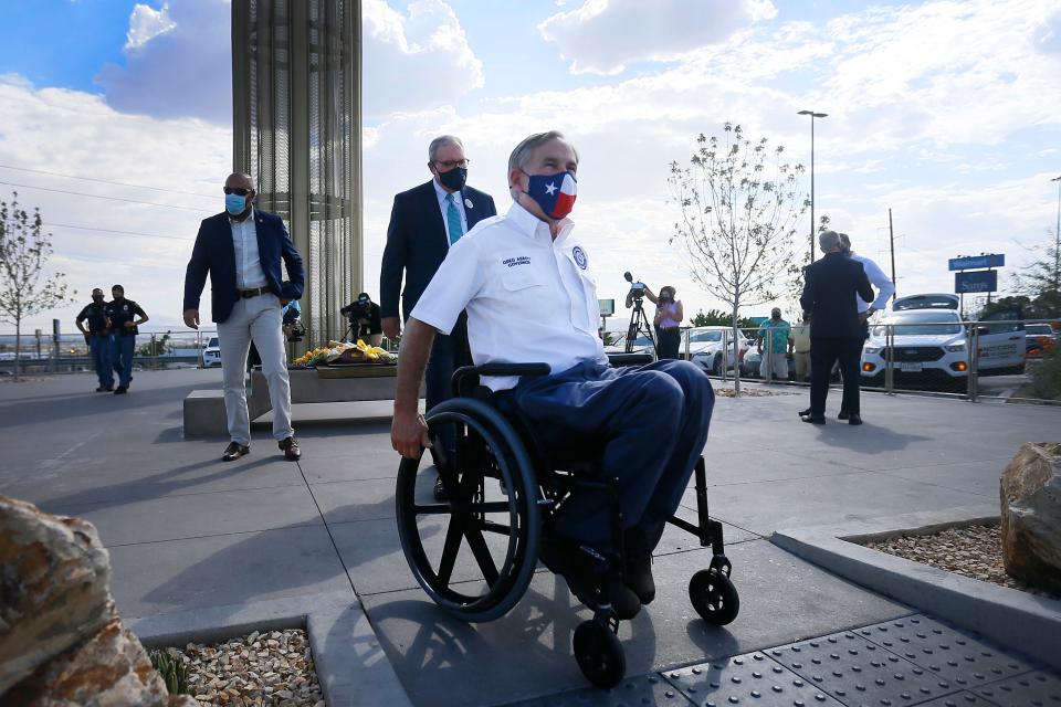 Gov. Greg Abbott visits a memorial at an El Paso shopping center to the victims of the 2019 mass shooting at a Walmart there.