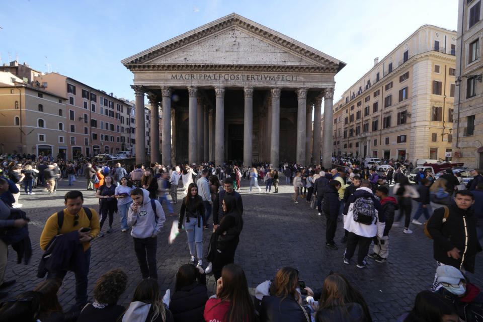 Tourists queue to visit Rome's Pantheon in Rome, Thursday, March 16, 2023. Visitors to Rome's Pantheon, Italy's most-visited cultural site, will soon be charged a 5-euros entrance fee under an agreement signed Thursday, March 16, 2023 by Italian culture and church officials. (AP Photo/Alessandra Tarantino)