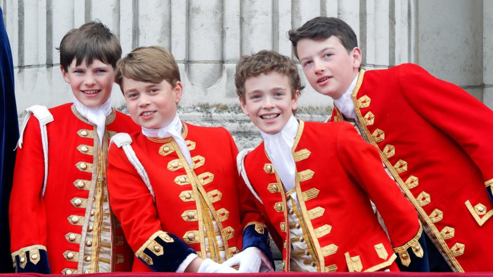 Page of Honour Ralph Tollemache, Prince George of Wales (in his role as Page of Honour), Page of Honour Lord Oliver Cholmondeley and Page of Honour Nicholas Barclay watch an RAF flypast