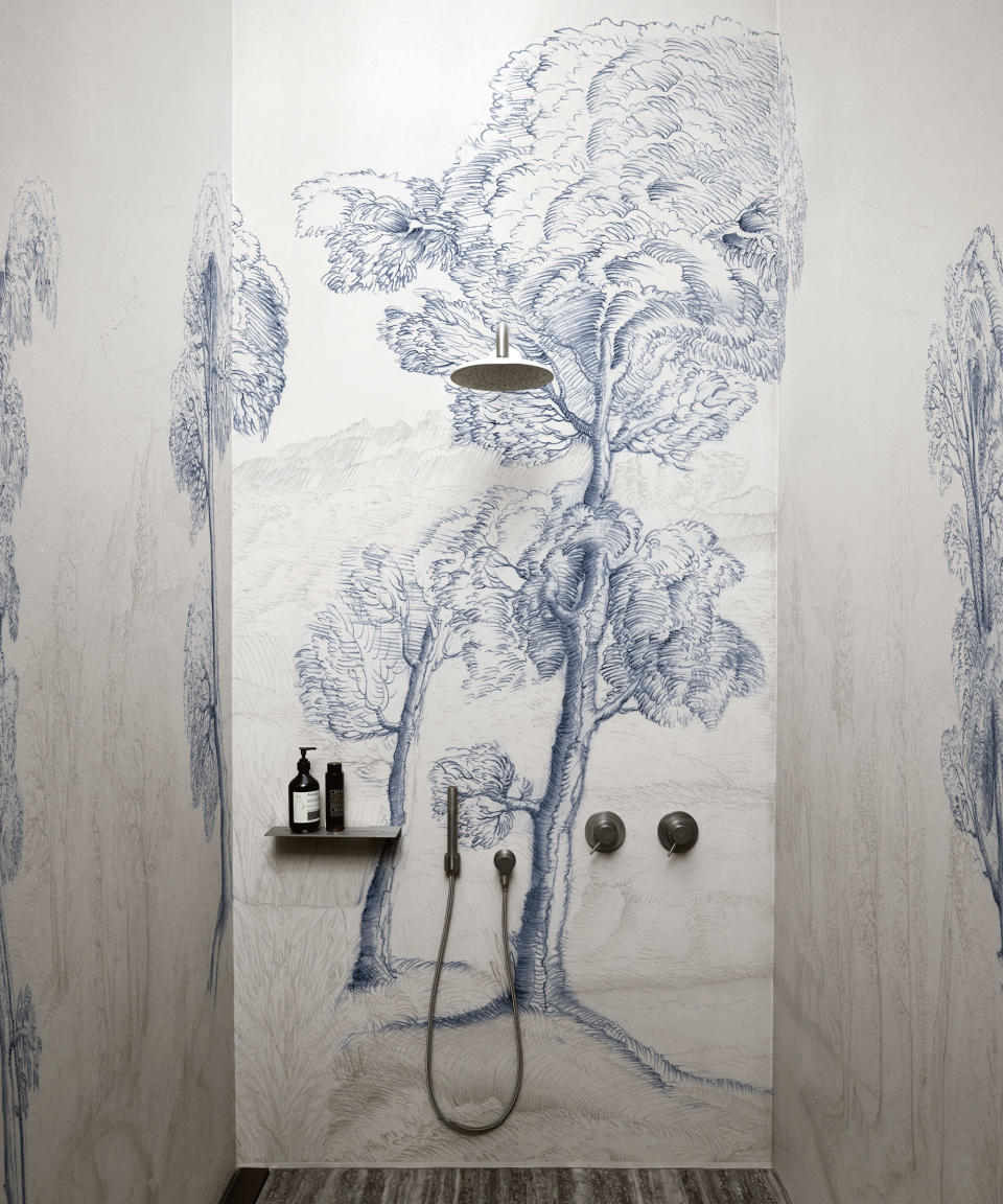 Bathroom wallpaper ideas, featuring a sketch-style white and blue tree print paper hung in a shower room.