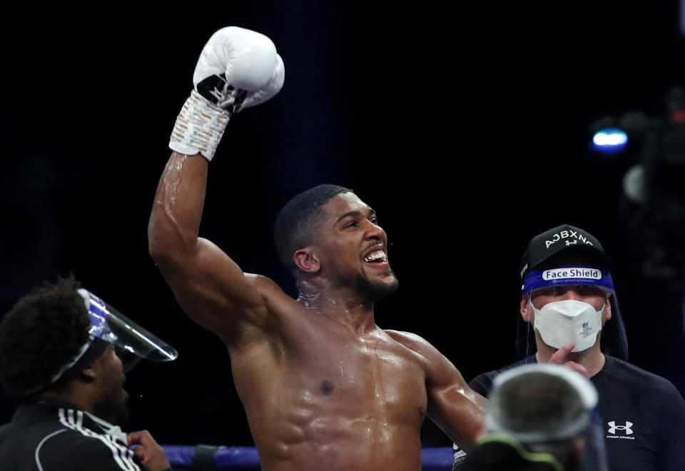 British boxer Anthony Joshua celebrates winning the Heavyweight World Title fight against Kubrat Pulev at the SSE Arena, Wembley, London, on 12 December 2020. Photo: Andrew Couldridge/Reuters