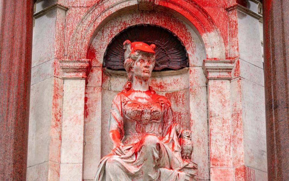 A Queen Victoria monument was also covered in red paint