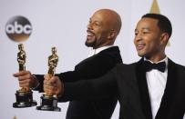 Singers Common (L) and John Legend take the stage to pose with their Oscars after winning the award for best original song for "Glory" from the film "Selma" during the 87th Academy Awards in Hollywood, California February 22, 2015. REUTERS/Lucy Nicholson