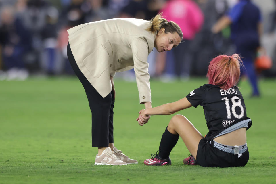 LOS ANGELES, CALIFORNIA - MARCH 26: Head coach Freya Coombe of Angel City FC talks with Jun Endo #18 on the field following a game against the NJ/NY Gotham FC at BMO Stadium on March 26, 2023 in Los Angeles, California. (Photo by Katharine Lotze/Getty Images)