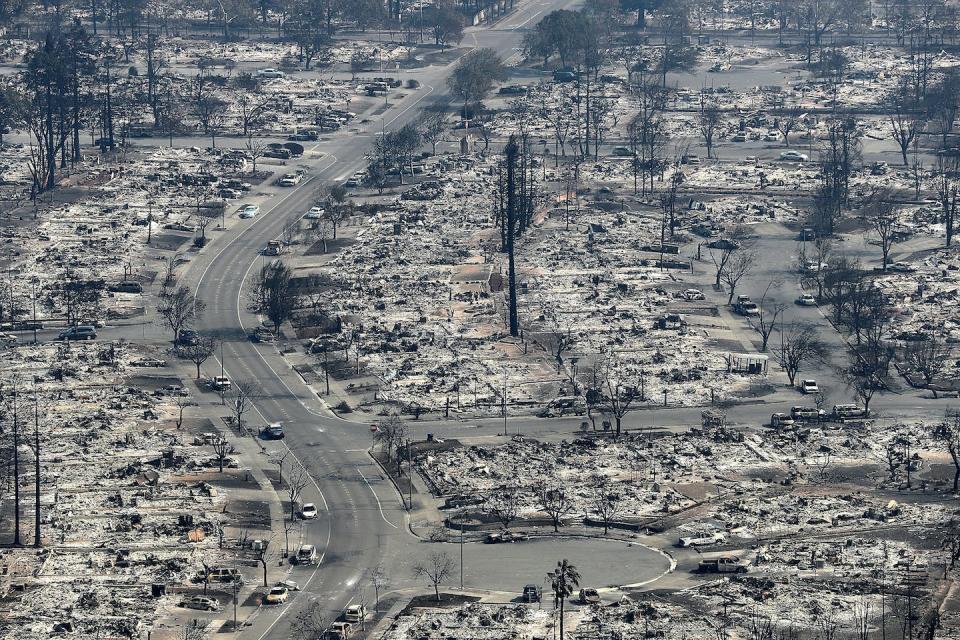 Entire neighborhoods were reduced to ash when a wildfire spread into Santa Rosa, California, in 2017. <a href="https://www.gettyimages.com/detail/news-photo/an-aerial-view-of-homes-that-were-destroyed-by-the-tubbs-news-photo/860298164" rel="nofollow noopener" target="_blank" data-ylk="slk:Justin Sullivan/Getty Images;elm:context_link;itc:0;sec:content-canvas" class="link ">Justin Sullivan/Getty Images</a>