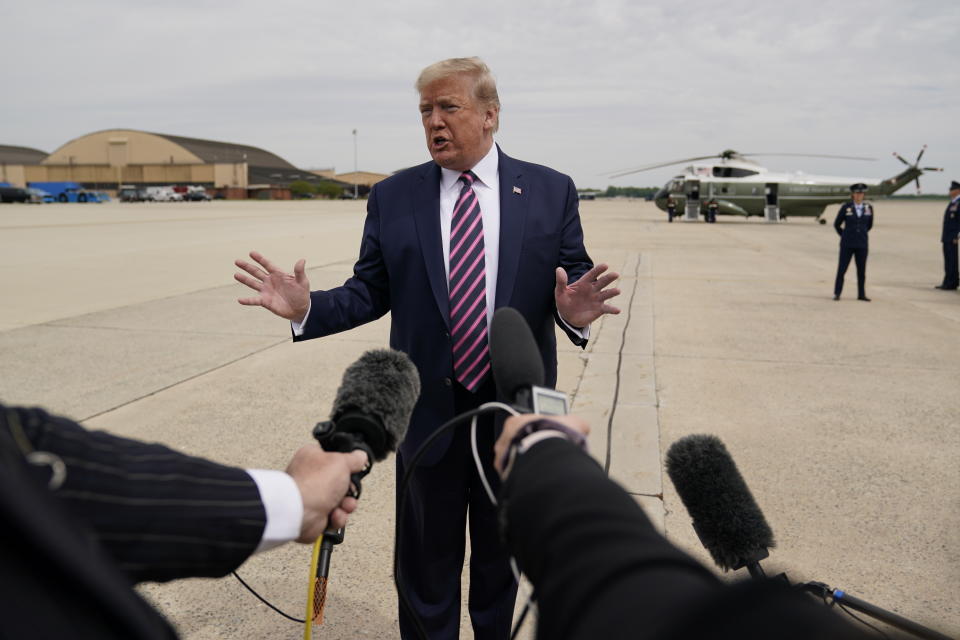 FILE - In this May 5, 2020, file photo, President Donald Trump talks to the media before boarding Air Force One for a trip to Phoenix to visit a Honeywell plant that manufactures protective equipment, at Andrews Air Force Base, Md. The coronavirus pandemic is complicating what has been a May reelection campaign launch for recent presidents. Trump has told reporters recently he would travel soon to Ohio, a battleground state. (AP Photo/Evan Vucci, File)