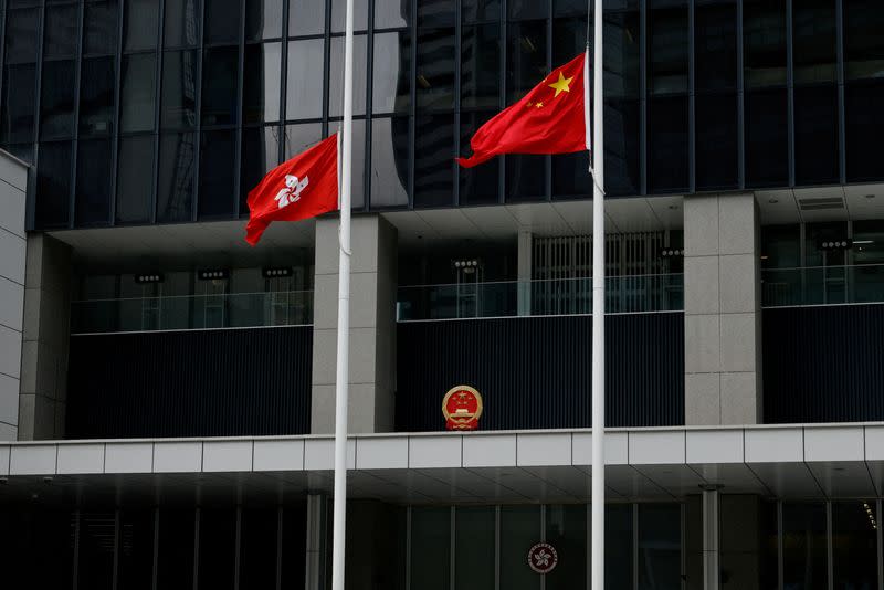 Chinese and Hong Kong flags are lowered to half-staff, following the death of former Chinese President Jiang Zemin, at Central Government Offices in Hong Kong