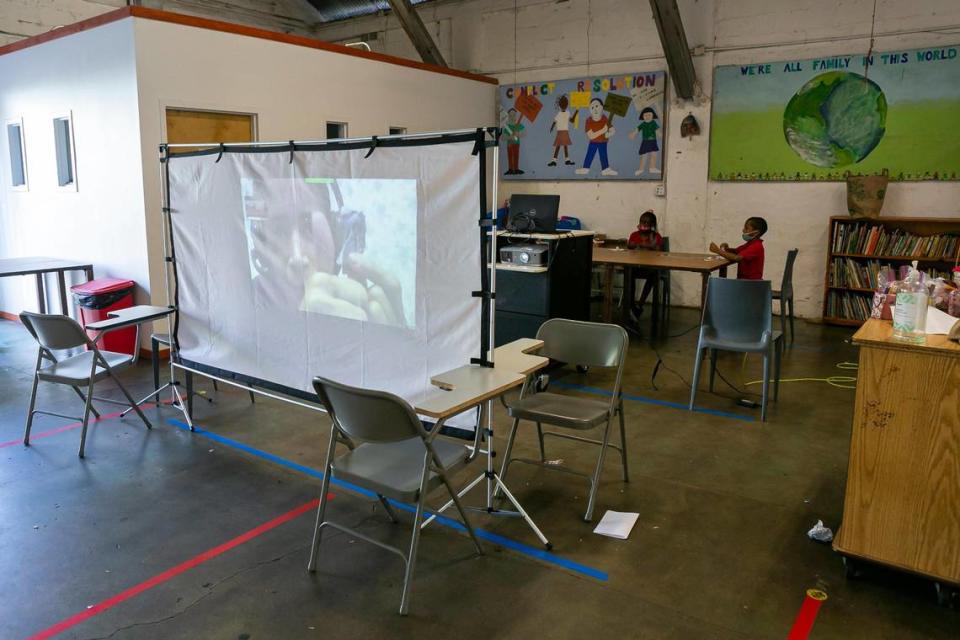 Students participate in an online art class while attending the Barnyard on Monday, Feb. 8, 2021. The after-school program has continued by creating programs in art and music, for example, that are socially distanced and follow CDC protocols.