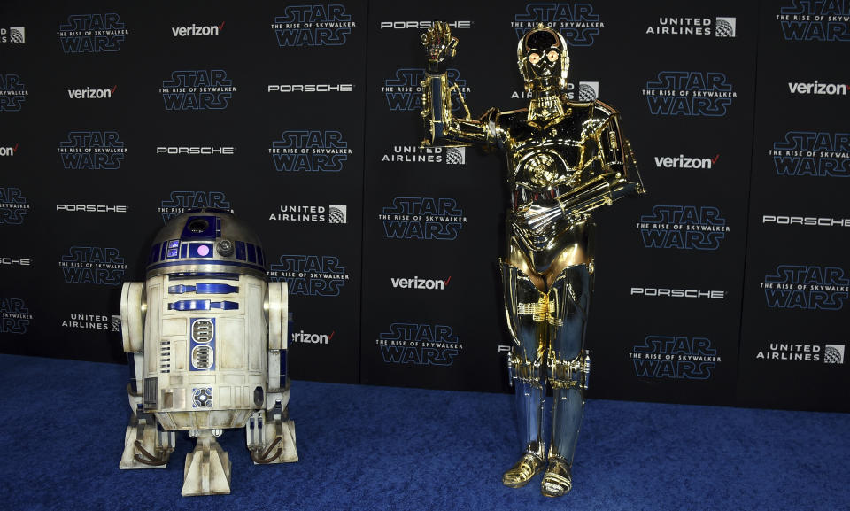 R2-D2, left, and C-3PO characters arrive at world premiere of "Star Wars: The Rise of Skywalker" on Monday, Dec. 16, 2019, in Los Angeles (Jordan Strauss/Invision/AP)