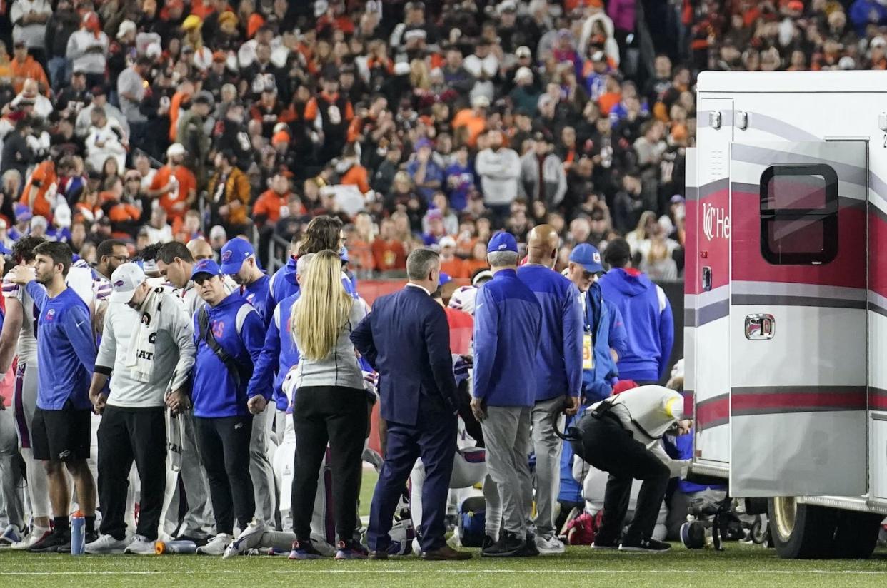 Medical personnel attend to Buffalo Bills safety Damar Hamlin after he collapsed on the field during an NFL game in Cincinnati on Jan. 2, 2023. <a href="https://newsroom.ap.org/detail/BillsBengalsFootball/cb4e320fc1b7472cbe0c692d94d07a6e/photo?Query=damar%20hamlin&mediaType=photo&sortBy=arrivaldatetime:desc&dateRange=Anytime&totalCount=453&currentItemNo=112" rel="nofollow noopener" target="_blank" data-ylk="slk:AP Photo/Joshua A. Bickel;elm:context_link;itc:0;sec:content-canvas" class="link ">AP Photo/Joshua A. Bickel</a>