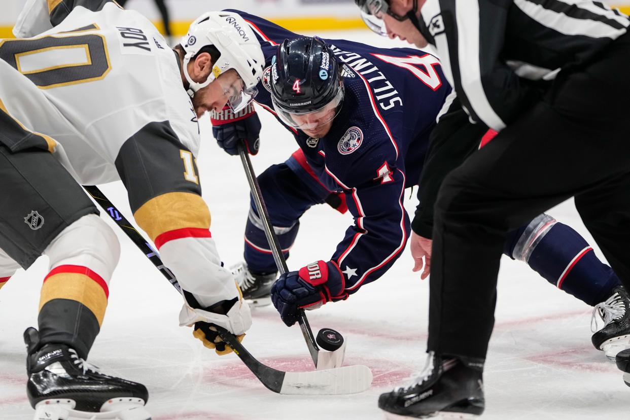 Mar 4, 2024; Columbus, Ohio, USA; Columbus Blue Jackets center Cole Sillinger (4) takes a face off against Vegas Golden Knights center Nicolas Roy (10) during the first period of the NHL hockey game at Nationwide Arena.