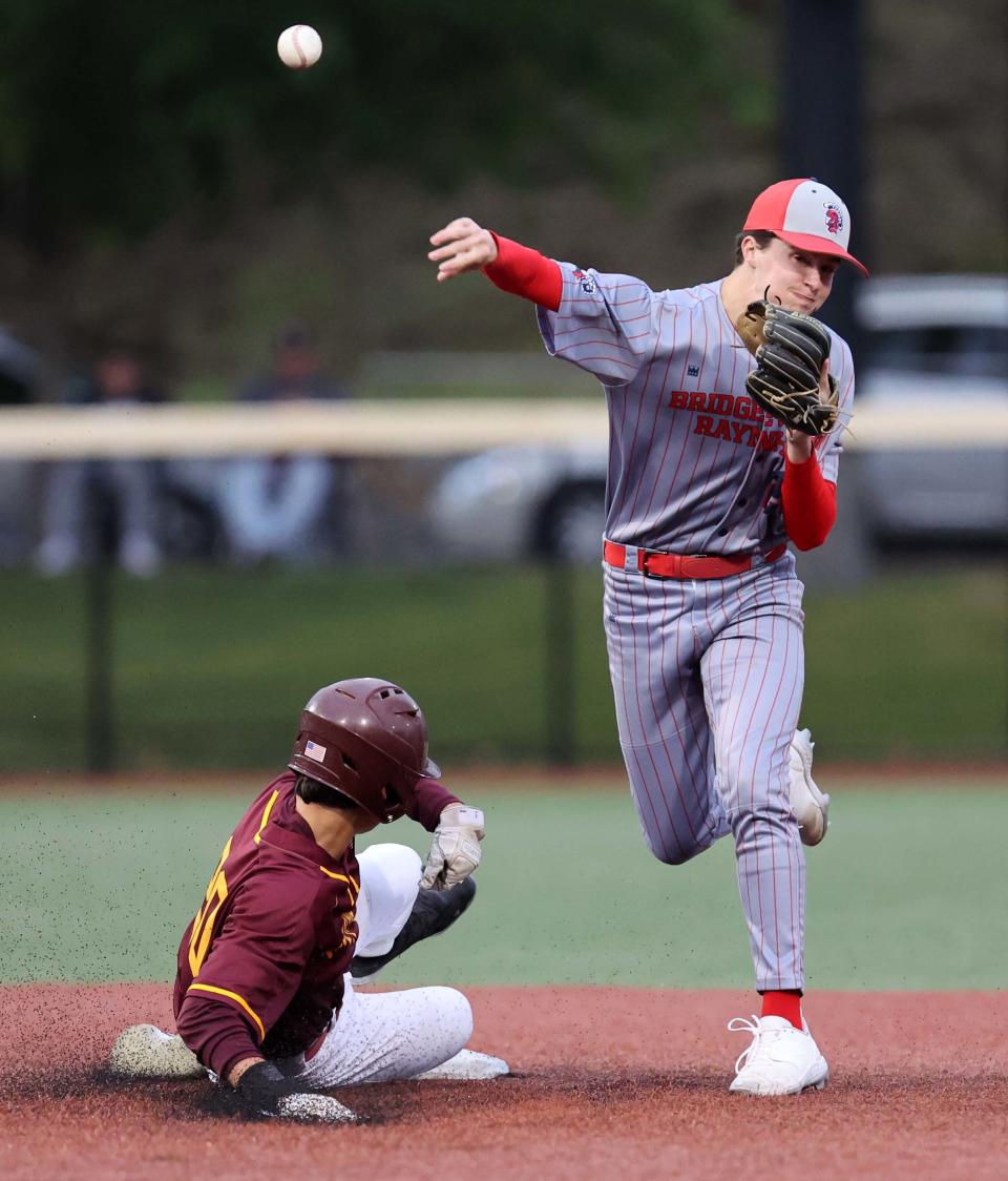 Bridgewater-Raynham's Jack Ritchie attempts to turn the double play on Weymouth's Matt Suplee during a game on Wednesday, June 7, 2023.  