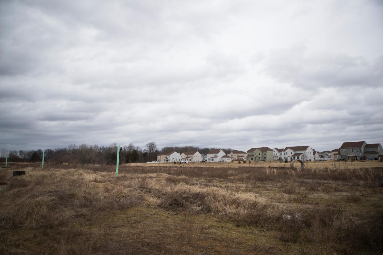 An open field precedes a treeline on the northern edge of the Bayberry community near Middletown.