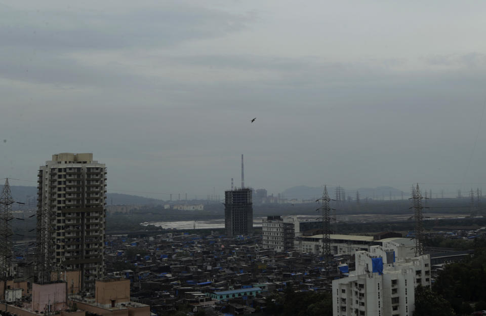 Dark clouds gather over the skyline in Mumbai, India, Tuesday, June 2, 2020. A cyclone in the Arabian Sea was barreling toward India's business capital Mumbai on Tuesday, threatening to deliver high winds and flooding to an area already struggling with the nation's highest number of coronavirus infections and deaths. (AP Photo/Rajanish Kakade)