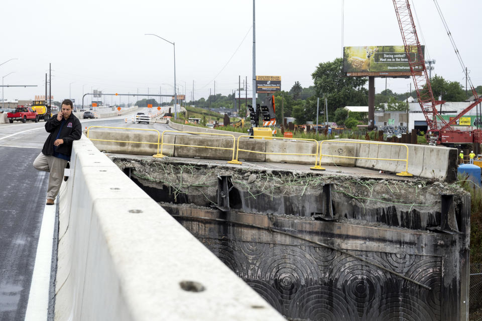 A section of the southbound side of Interstate 95 is seen removed as a news conference is held by the repaired section to announce the highway's reopening Friday, June 23, 2023 in Philadelphia. Workers put the finishing touches on an interim six-lane roadway that will serve motorists during construction of a permanent bridge. (AP Photo/Joe Lamberti)