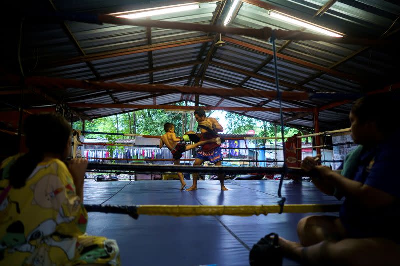 The Wider Image: Punching out of poverty: Despite risks, nine-year-old Thai fighter eager to return to ring