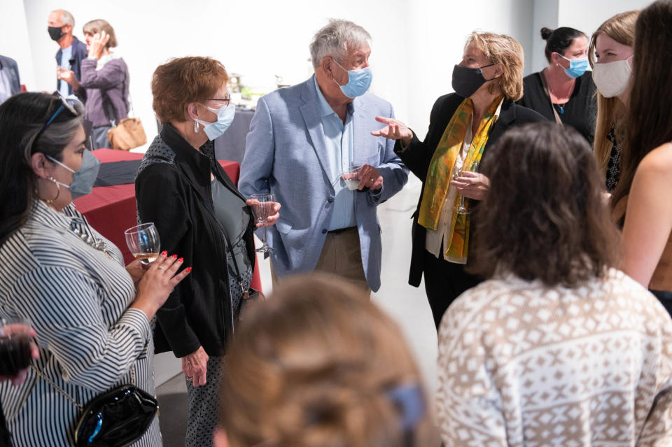 Silvia Marinas-Feliner (right) speaks to Candis J. Stern and her husband David Chapman at a reception at NMSU’s University Art Museum to honor Stern for creating a $1.2 million endowment to support the Museum Conservation Program at NMSU. Stern met museum conservation program alumni and current students in the program.