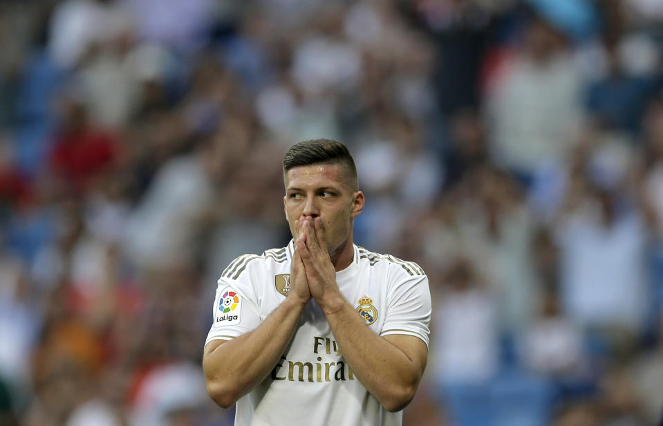 Real Madrid's Luka Jovic gestures during the Spanish La Liga soccer match between Real Madrid and Valladolid at the Santiago Bernabeu stadium in Madrid, Spain, Saturday, Aug. 24, 2019. (AP Photo/Paul White)