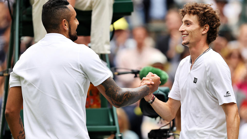 Nick Kyrgios and Ugo Humbert shake hands after their five-set marathon in Wimbledon's first round. (Photo by Clive Brunskill/Getty Images)