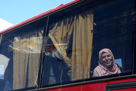 A Syrian refugee is seen on a bus at the Kokkinotrimithia refugee camp outside Nicosia, Cyprus September 10, 2017. REUTERS/Yiannis Kourtoglou