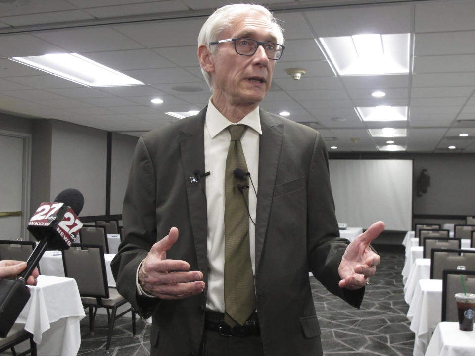 Wisconsin Gov. Tony Evers talks to reporters Wednesday, Feb. 20, 2019, in Madison, Wis. Evers says he anticipates not supporting a Republican middle class tax cut bill that passed with no Democratic votes. (AP Photo/Scott Bauer)