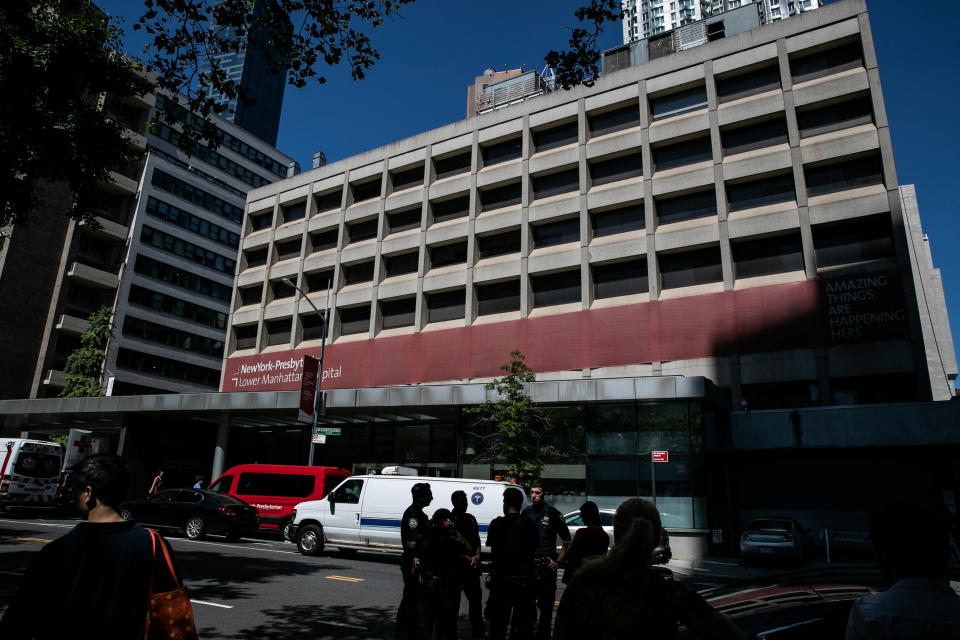 Police officers stand outside New York Presbyterian-Lower Manhattan Hospital, where Jeffrey Epstein's body was transported, in Manhattan borough of New York City, New York, U.S., August 10, 2019. REUTERS/Jeenah Moon