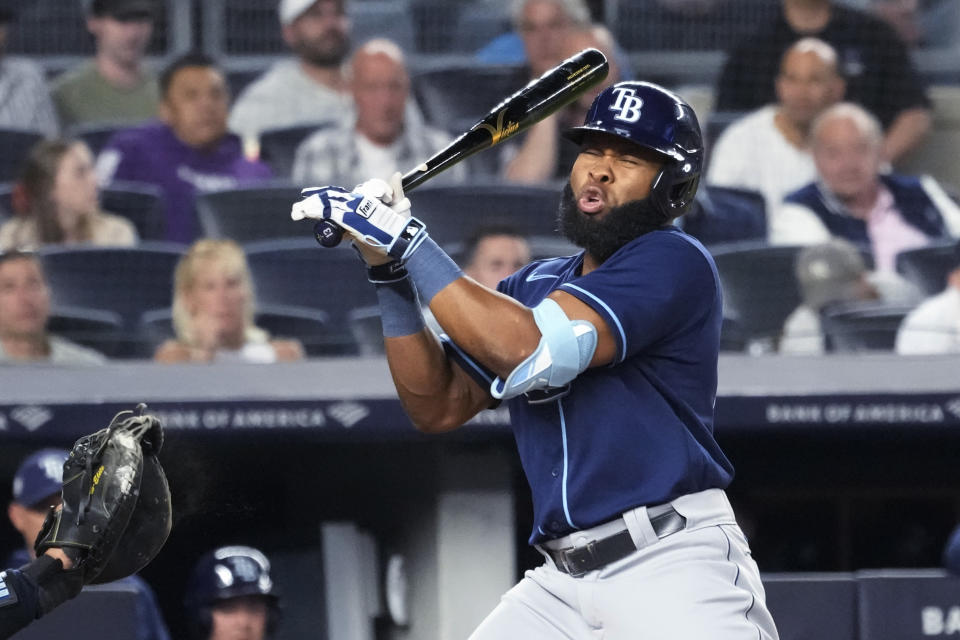 Tampa Bay Rays' Manuel Margot reacts after being hit by a pitch from New York Yankees' Ron Marinaccio during the sixth inning of a baseball game Thursday, May 11, 2023, in New York. (AP Photo/Mary Altaffer)