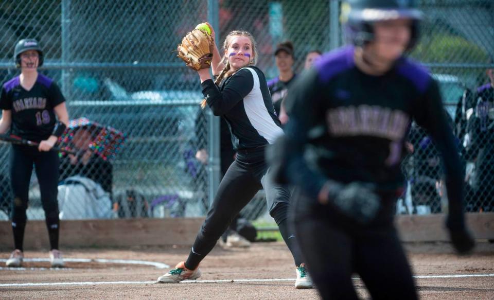 Puyallup third baseman Kyra Smith fires to first base during the Vikings’ fastpitch game against the Sumner Spartans at Puyallup High School in Puyallup, Washington, on Wednesday, April 27, 2022.