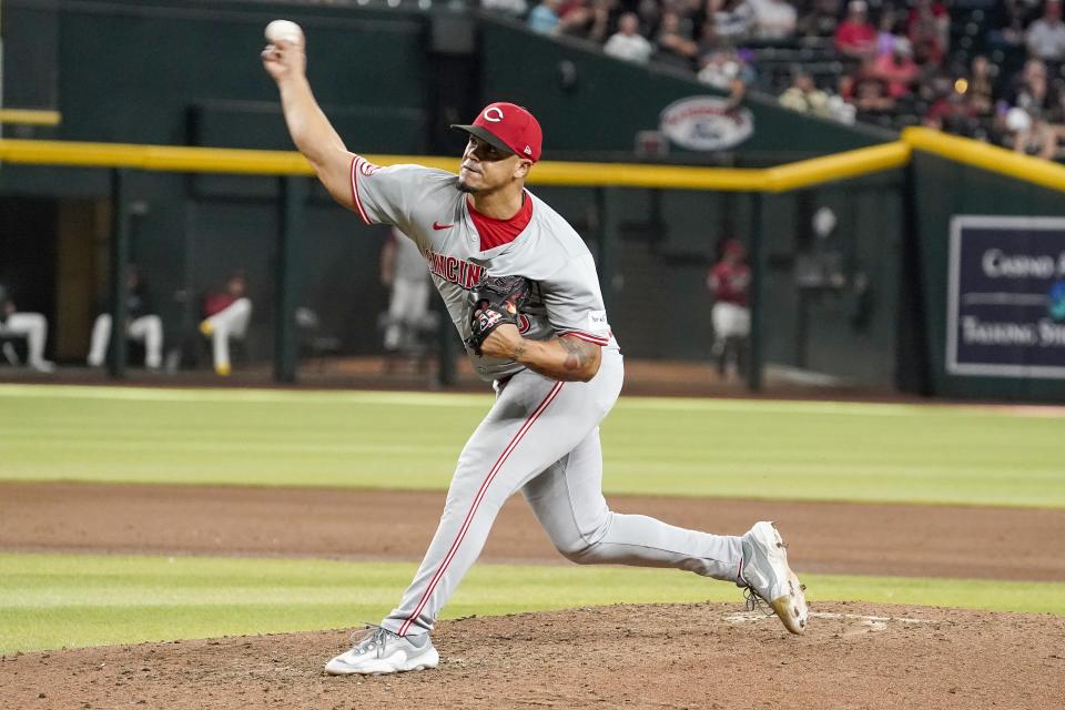 Cincinnati Reds pitcher Fernando Cruz throws against the Arizona Diamondbacks during the eighth inning of a baseball game Wednesday, May 15, 2024, in Phoenix. (AP Photo/Darryl Webb)