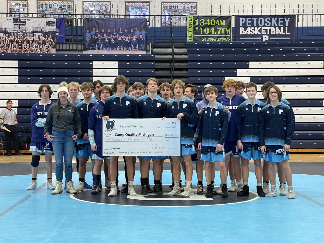 The Petoskey wrestling team welcomed in Sault Ste. Marie and Charlevoix this week, then also presented a check to Camp Quality and program director Sarah Hoffman of just over $5,000 raised during the Carl VanderWall Memorial meet.