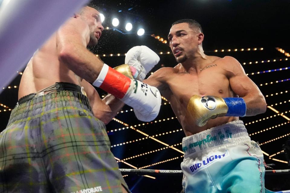 Taylor (left) came up short on all three judges’ scorecards (AP)