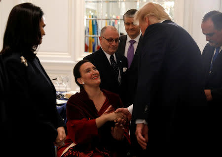 U.S. President Donald Trump meets Argentina Vice President Gabriela Michetti during a working dinner with Latin American leaders in New York, U.S., September 18, 2017. REUTERS/Kevin Lamarque