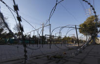 In this Monday, Feb. 17, 2020, photo, a security check point set up near Rawalpindi cricket stadium in preparation for upcoming Pakistan Super League, in Rawalpindi, Pakistan. Security concerns stopped foreign cricketers from touring Pakistan four years ago when the country's premier domestic Twenty20 tournament was launched, forcing organizers to stage the event on neutral turf in the United Arab Emirates. When the 2020 edition of the PSL starts in Karachi on Thursday, Darren Sammy of the West Indies and Shane Watson of Australia will be among 36 foreign cricketers involved in the six franchises. (AP Photo/Anjum Naveed)