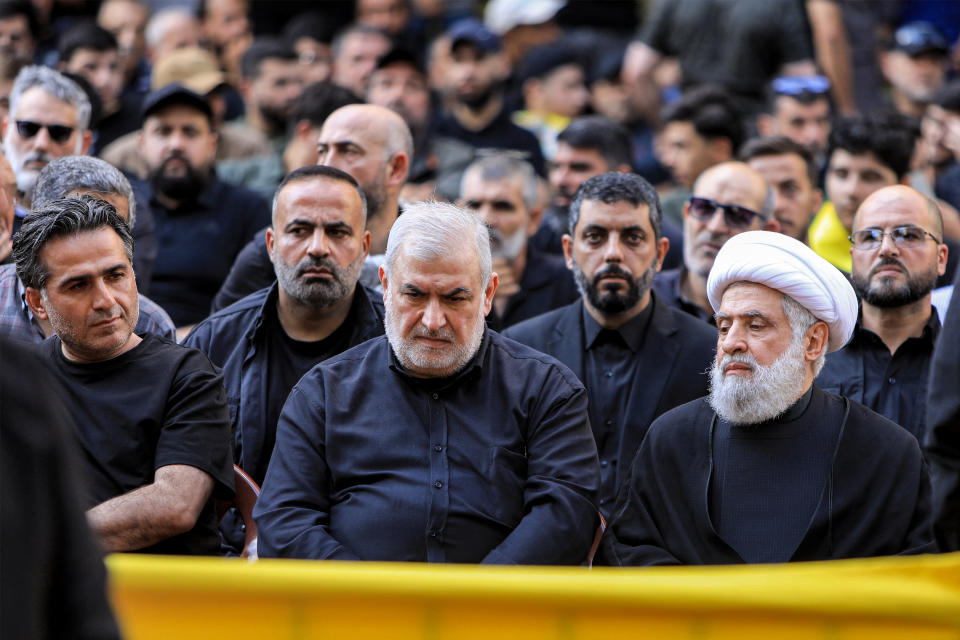 TOPSHOT - Naim Qassem (R), deputy secretary-general of the Lebanese Shiite movement Hezbollah, and Mohammed Raad (C), head of Hezbollah's bloc in the Lebanese parliament, attend the funeral of top Hezbollah military commander Ibrahim Aqil in Beirut's southern suburbs on September 22, 2024. Ibrahim Aqil and other commanders of Hezbollah's 